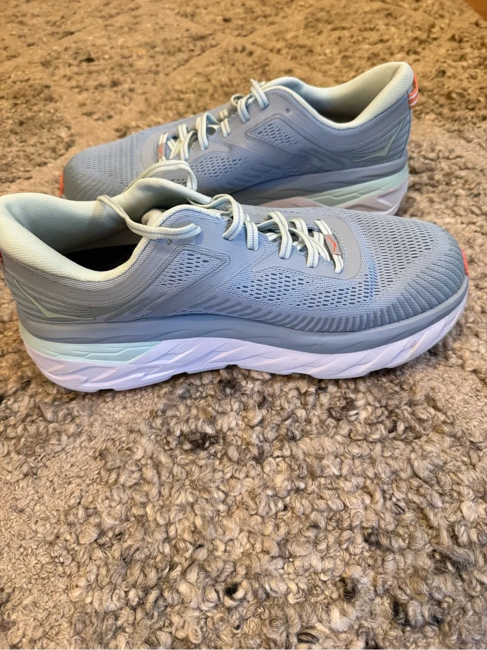 Hoka Pale Gray Running Shoes with orange Accents